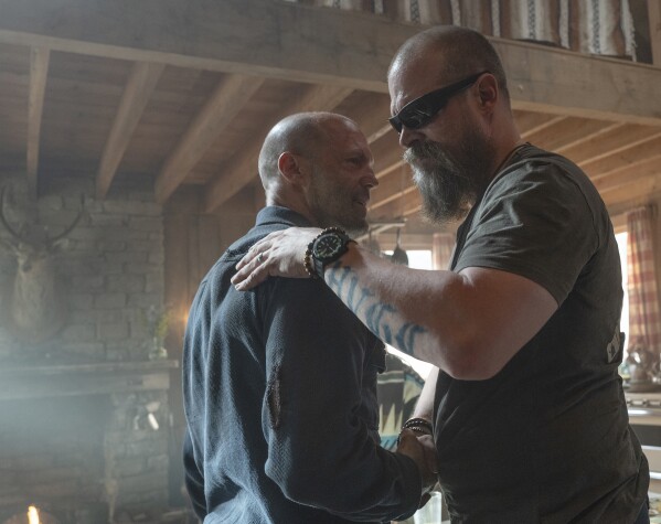 This image released by Amazon MGM Studios shows Jason Statham, left, and David Harbour in a scene from "A Working Man." (Dan Smith/Amazon MGM Studios via AP)