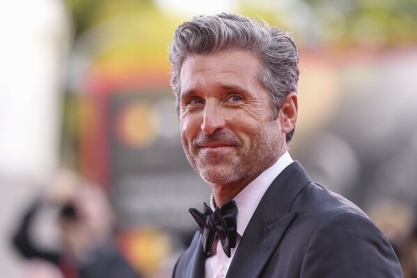 FILE - Patrick Dempsey poses for photographers upon arrival for the premiere of the film "Ferrari" during the 80th edition of the Venice Film Festival, Aug. 31, 2023, in Venice, Italy. On Tuesday, Nov, 7, People magazine named Dempsey as its Sexiest Man Alive. (Photo by Vianney Le Caer/Invision/AP, File)