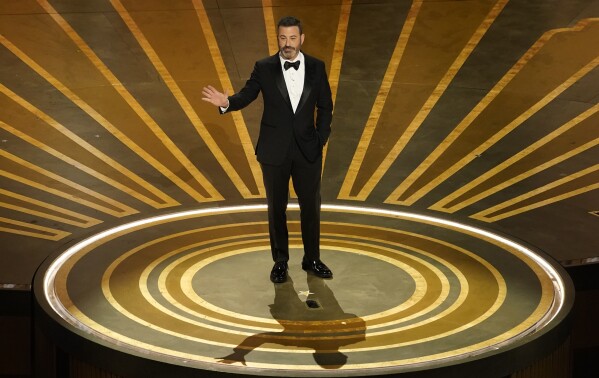 FILE - Host Jimmy Kimmel speaks at the Oscars on March 12, 2023, at the Dolby Theatre in Los Angeles. Kimmel will host the 96th Oscars on Sunday. (AP Photo/Chris Pizzello, File)