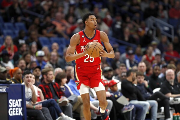 FILE - New Orleans Pelicans guard Trey Murphy III (25) moves down the court in the first half of an NBA basketball game against the San Antonio Spurs in New Orleans, March 21, 2023. Murphy III, a 2021 first-round draft choice who emerged as a frequent starter and reliable scorer last season, injured the meniscus in left knee while working out at team headquarters on Tuesday, Sept. 5, a person with knowledge of the situation said. (AP Photo/Tyler Kaufman, File)