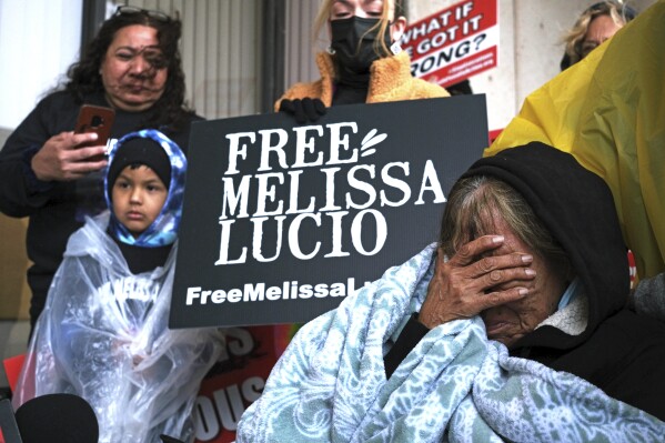 FILE - Esperanza Treviño, Melissa Lucio's mother, pleas to the public as she is surrounded by family and friends on the steps of the Cameron County Courthouse Administrative entrance in Brownsville, Texas, Feb. 7, 2022, that her daughter is innocent and was wrongfully sentenced to death for the murder of Lucio's 2-year-old daughter, Mariah. Lucio, whose execution was delayed in 2022 amid growing doubts she fatally beat her 2-year-old daughter had evidence suppressed at her murder trial, prosecutors now say in the case of Lucio, whose cause has drawn the backing of celebrities including Kim Kardashian. (Miguel Roberts/The Brownsville Herald via AP, File)
