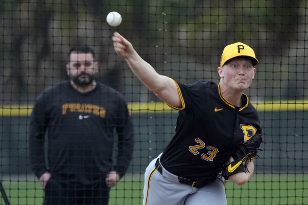 FILE - Pittsburgh Pirates starting pitcher Mitch Keller throws during a baseball spring training workout Saturday, Feb. 17, 2024, in Bradenton, Fla. The Pirates and Keller agreed to a five-year contract on Thursday worth $77 million. The deal is pending a physical, a person with knowledge of the agreement told The Associated Press Thursday, Feb. 22, 2024. The person spoke on the condition of anonymity because it was not yet final. (AP Photo/Charlie Neibergall, File)