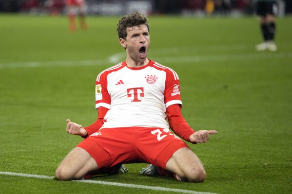FILE - Bayern's Thomas Mueller celebrates a goal that was later disallowed by a VAR decision during the German Bundesliga soccer match between Bayern Munich and Stuttgart in Munich, Germany, Sunday, Dec. 17, 2023. Bayern Munich has handed experienced forward Thomas Müller a one-year contract extension through to the end of the 2024-25 season, putting him within sight of the club's all-time appearance record.(AP Photo/Matthias Schrader, File)