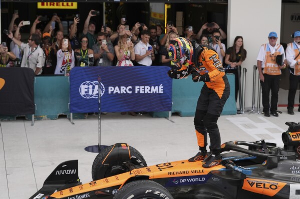 McLaren driver Oscar Piastri of Australia stands on top of his car after winning the Formula One Miami Grand Prix auto race Sunday, May 4, 2025, in Miami Gardens. Fla. (AP Photo/Rebecca Blackwell)