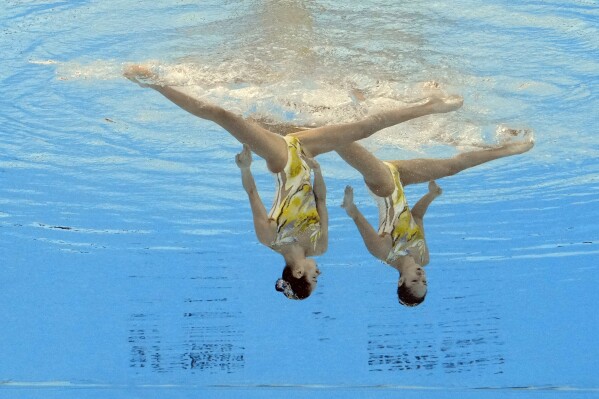 FILE - Wang Liuyi and Wang Qianyi, of China, compete in the women's duet technical final of artistic swimming at the World Aquatics Championships in Doha, Qatar, Monday, Feb. 5, 2024. (AP Photo/Lee Jin-man, File)