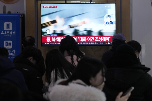 A TV screen shows a file image of North Korea's military exercise during a news program at the Seoul Railway Station in Seoul, South Korea, Saturday, Jan. 6, 2024. North Korea conducted a new round of artillery drills near the disputed sea boundary with South Korea on Saturday, officials in Seoul said, a day after the North's earlier exercises prompted South Korea to respond with its own drills in the same area. (AP Photo/Ahn Young-joon)