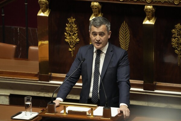 French Interior Minister Gerald Darmanin delivers a speech at the French National Assembly in Paris, Monday, dec. 11, 2023. A divisive migration bill that would speed up deportations reaches the lower house of French parliament. (AP Photo/Michel Euler)