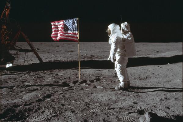 FILE - In this July 20, 1969 photo made available by NASA, astronaut Buzz Aldrin Jr. poses for a photograph beside the U.S. flag on the moon during the Apollo 11 mission. Aldrin and fellow astronaut Neil Armstrong were the first men to walk on the lunar surface with temperatures ranging from 243 degrees above to 279 degrees below zero. Astronaut Michael Collins flew the command module. (Neil Armstrong/NASA via ĢӰԺ, File)