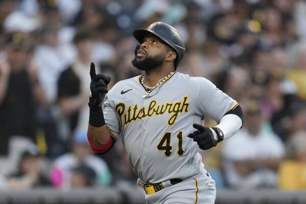 Pittsburgh Pirates' Carlos Santana celebrates after hitting a two-run home run during the third inning of a baseball game against the San Diego Padres, Monday, July 24, 2023, in San Diego. (AP Photo/Gregory Bull)