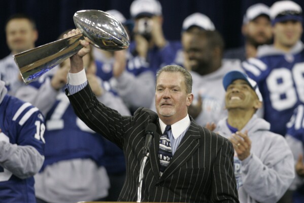 Indianapolis Colts owner Jim Irsay raises the Vince Lombardi trophy during a rally in Indianapolis, Monday, Feb. 5, 2007. The Colts defeated the Chicago Bears to win Super Bowl XLI. (AP Photo/Darron Cummings, File)