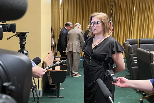 FILE - Nebraska state Sen. Machaela Cavanaugh speaks to reporters, Thursday, March 18, 2024, in Lincoln, Neb. A bill to limit transgender students’ access to bathrooms and sports teams has been advanced out of committee with just days to go until the end of the session. Cavanaugh says she will filibuster bills not yet passed if Omaha Sen. Kathleen Kauth's bathroom and sports bill advances. Speaker of the Legislature Sen. John Arch announced late Thursday, April 4, 2024, that the bill would be debated the next day for no more than four hours. (AP Photo/Margery Beck, File)