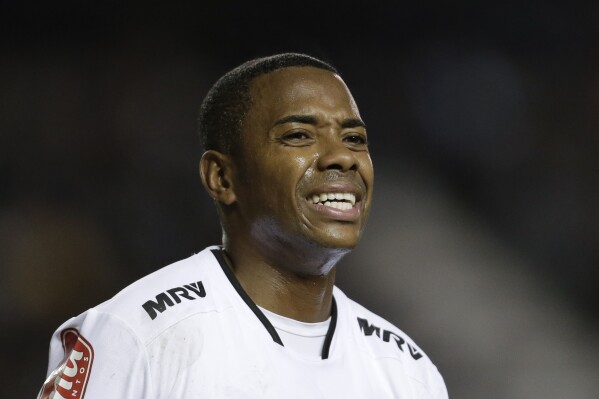FILE - Atletico Mineiro's Robinho reacts after failing to score during a Copa Libertadores soccer match against Argentina's Racing in Buenos Aires, Argentina, April 27, 2016. Former soccer star turned himself in on Thursday, March 21, 2024, to start serving a nine-year prison sentence in his native Brazil more than 10 years after he was first accused of raping a woman in Italy. (AP Photo/Victor R. Caivano, File)