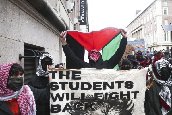 A group of protesters in support of Palestinians march away from Columbia University on Wednesday, May 21, 2025, in New York. (AP Photo/Heather Khalifa)