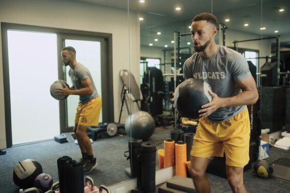 This image released by Apple TV+ shows Stephen Curry in a scene from the documentary "Stephen Curry: Underrated." (Apple TV+ via AP)