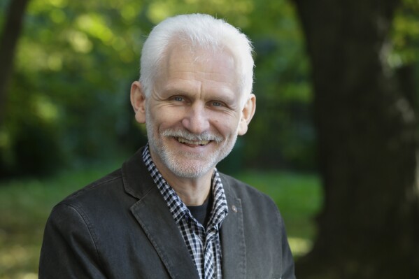 Ales Bialiatski, the head of the Viasna human rights group, poses for a photo in Minsk, Belarus, Oct. 7, 2014. (AP Photo, File)