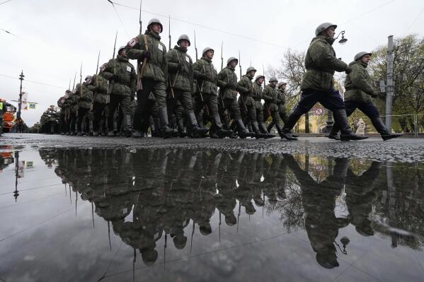 Russian army soldiers march to attend a dress rehearsal for the Victory Day military parade at the Dvortsovaya (Palace) Square in St. Petersburg, Russia, Wednesday, May 7, 2025. (AP Photo/Dmitri Lovetsky)