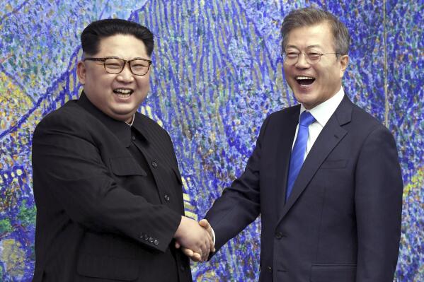 FILE - North Korean leader Kim Jong Un, left, poses with South Korean President Moon Jae-in for a photo inside the Peace House at the border village of Panmunjom in Demilitarized Zone, South Korea on April 27, 2018. The leaders of the rival Koreas have exchanged letters expressing hope for improved bilateral relations, which plummeted in the past three years amid a freeze in nuclear negotiations and North Korea's accelerating weapons development. (Korea Summit Press Pool via AP, File)