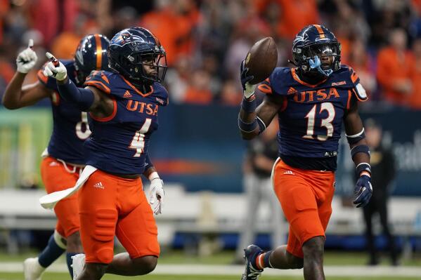 UTSA safety Antonio Parks (4) and safety Jahmal Sam (13) celebrate a turnover against Southern Mississippi during the second half of an NCAA college football game, Saturday, Nov. 13, 2021, in San Antonio. UTSA won 27-17. (AP Photo/Eric Gay)