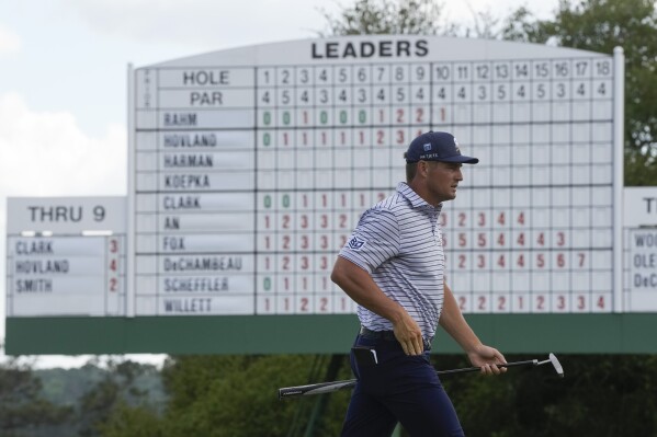Bryson DeChambeau walks on the 17th green during the first round at the Masters golf tournament at Augusta National Golf Club Thursday, April 11, 2024, in Augusta, Ga. (AP Photo/Charlie Riedel)