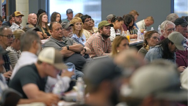 Workers from eastern Utah's oil and gas industry and others attend a Utah Division of Oil, Gas and Mining meeting on July 13, 2023, in Duchesne, Utah. The department convenes regular public meetings to update community members on industry-related news, including the Uinta Basin Railway. (AP Photo/Rick Bowmer)