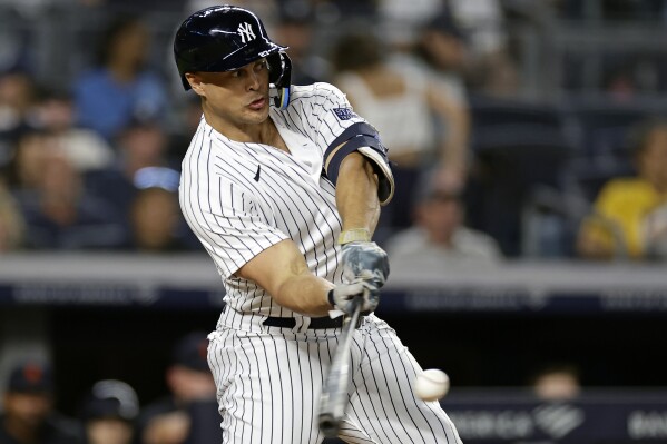 New York Yankees designated hitter Giancarlo Stanton hits a two-run home run against the Detroit Tigers during the sixth inning of a baseball game Tuesday, Sept. 5, 2023, in New York. The home run was Stanton's 400th in the majors. (AP Photo/Adam Hunger)