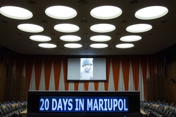 Associated Press journalist Mstyslav Chernov delivers a video message from the field in Ukraine before the screening of the award-winning documentary "20 Days in Mariupol" at the United Nations headquarters, Monday, Sept. 11, 2023. (AP Photo/Eduardo Munoz Alvarez)