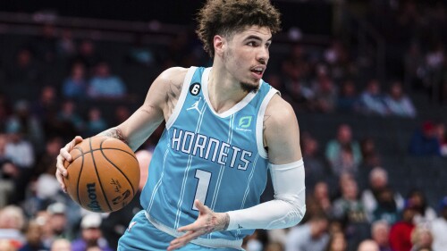 FILE - Charlotte Hornets guard LaMelo Ball brings the ball upcourt during the first half of an NBA basketball game against the Detroit Pistons in Charlotte, N.C., Monday, Feb. 27, 2023. LaMelo Ball could have tried to force his way out of Charlotte in hopes of landing with an established NBA playoff contender in the next few years. Instead the 2022 All-Star point guard decided to embrace his current situation with the Hornets by signing a five-year contract earlier this month that will pay him up to $260 million.(AP Photo/Jacob Kupferman, File)