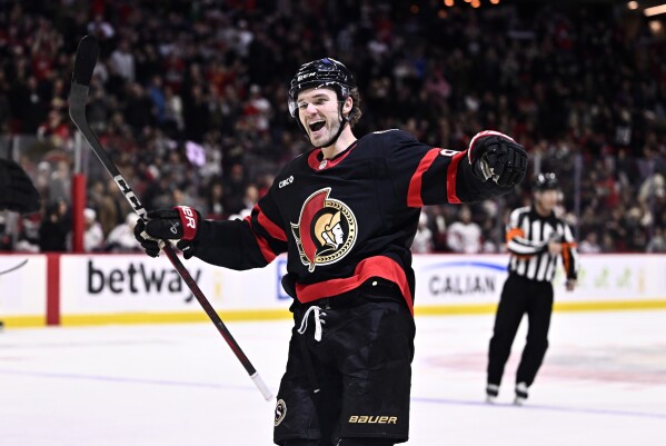 Ottawa Senators' Josh Norris (9) celebrates a goal by Shane Pinto (12), not shown, during second period NHL hockey action against the Washington Capitals in Ottawa, on Thursday, Jan. 30, 2025. (Justin Tang/The Canadian Press via AP, File)