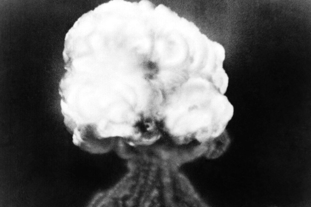 This is the mushroom cloud of the first atomic explosion at Trinity Test Site, New Mexico, July 16, 1945.  It left a half-mile wide crater, ten feet deep at the vent and the sand within the crater had been burned and boiled into a highly radioactive, jade-green, glassy crust. (AP Photo)