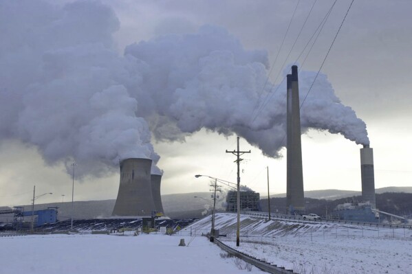 FILE - The Conemaugh Generation Station emits steam in New Florence, Pa., Feb. 6, 2007. Pennsylvania cannot enforce a regulation to make power plant owners pay for their planet-warming greenhouse gas emissions, a state court ruled Wednesday, Nov. 1, 2023, dealing another setback to the centerpiece of former Gov. Tom Wolf's plan to fight global warming. (Todd Berkey/The Tribune-Democrat via AP, File)