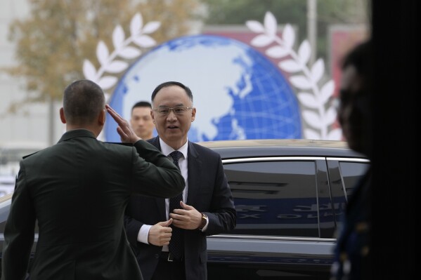 Nong Rong, Assistant Minister of Foreign Affairs of China, arrives for the 10th Beijing Xiangshan Forum in Beijing, Tuesday, Oct. 31, 2023. Singapore's Defense Minister Ng Eng Hen called on China, as a dominant power in Asia, to take the lead in reducing tensions by being a benevolent one, warning that military conflict like the wars in Ukraine and Gaza would be devastating to the region's future. (AP Photo/Ng Han Guan)