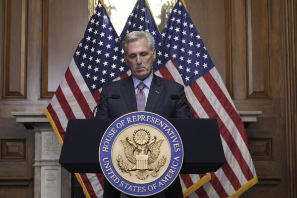FILE - Rep. Kevin McCarthy, R-Calif., speaks to reporters hours after he was ousted as Speaker of the House, Tuesday, Oct. 3, 2023, at the Capitol in Washington. McCarthy says he's resigning from his congressional seat in California two months after his historic ouster as House speaker. (AP Photo/J. Scott Applewhite, File)