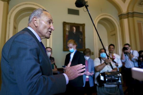 Senate Majority Leader Chuck Schumer, D-N.Y., updates reporters on the infrastructure negotiations between Republicans and Democrats, at the Capitol in Washington, Wednesday, July 28, 2021. (AP Photo/J. Scott Applewhite)