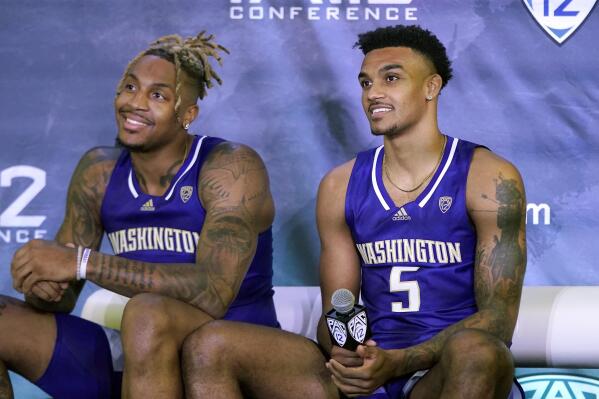 Washington's Nate Roberts, left, and Jamal Bey listen to questions during Pac-12 Conference NCAA college basketball media day Wednesday, Oct. 13, 2021, in San Francisco. (AP Photo/Jeff Chiu)