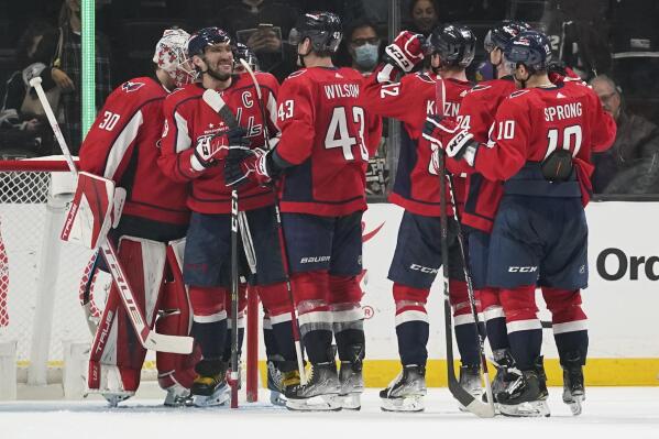 Washington Capitals celebrate a 2-0 win over the Los Angeles Kings after their NHL hockey game Wednesday, Nov. 17, 2021, in Los Angeles. (AP Photo/Ashley Landis)