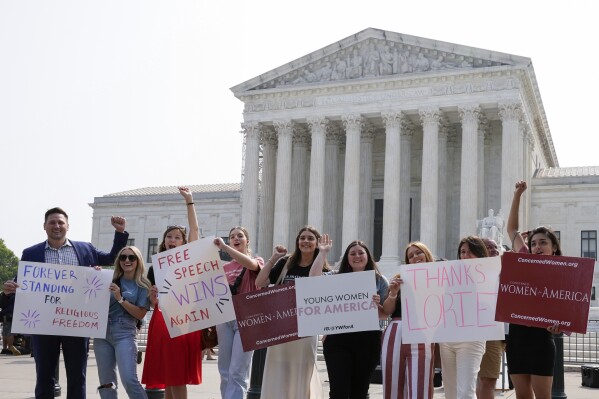 People react outside of the Supreme Court Friday, June 30, 2023, in Washington, after the Supreme Court's conservative majority ruled that a Christian graphic artist who wants to design wedding websites can refuse to work with same-sex couples. The court ruled 6-3 for designer Lorie Smith despite a Colorado law that bars discrimination based on sexual orientation, race, gender and other characteristics. Smith had argued that the law violates her free speech rights. (AP Photo/Mariam Zuhaib)