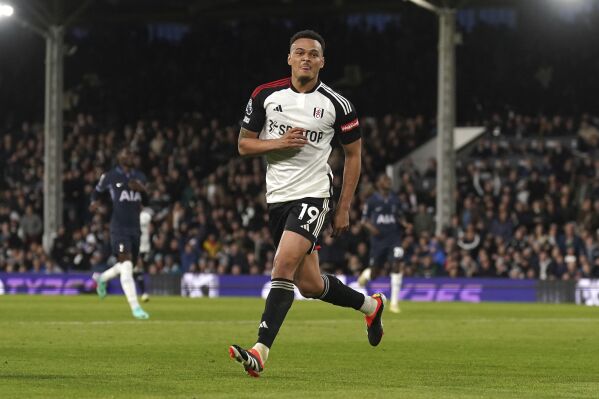 Fulham's Rodrigo Muniz celebrates after scoring the opening goal during a Premier League soccer match between FC Fulham and Tottenham Hotspur in London, England, Saturday, March 16, 2024. (Adam Davy/PA via AP)