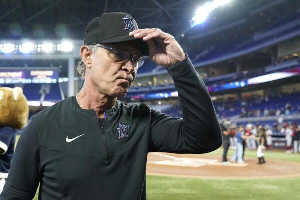 Miami Marlins manager Don Mattingly walks to the dugout before a baseball game against the Washington Nationals, Sunday, Sept. 25, 2022, in Miami. Mattingly will not be back as manager of the Marlins next season. (AP Photo/Lynne Sladky)
