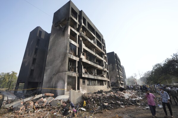 Search and rescue teams respond to the scene of a plane crash in Ahmedabad, India, Thursday, June 12, 2025. (AP Photo/Ajit Solanki)