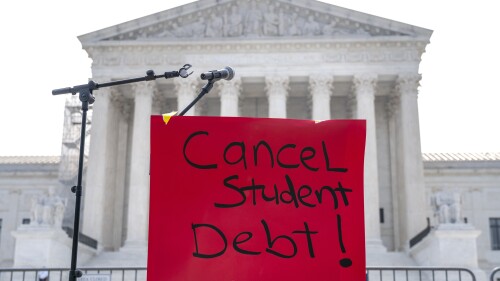 A sign reading "cancel student debt" is seen outside the Supreme Court, Friday, June 30, 2023, as decisions are expected in Washington. (AP Photo/Jacquelyn Martin)