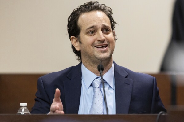 Charlie Adelson, a Fort Lauderdale periodontist, testifies during his trial, Thursday, Nov. 2, 2023, in Tallahassee, Fla. Adelson is charged with first-degree murder, conspiracy and solicitation in the killing of Dan Markel, a 41-year-old attorney and legal scholar at Florida State University. (Alicia Devine/Tallahassee Democrat via AP, Pool)