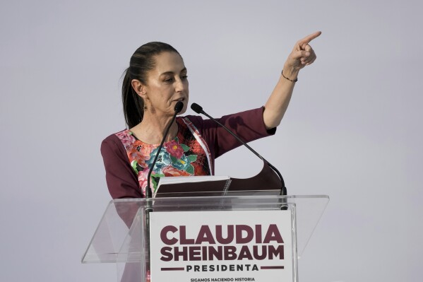 FILE - Presidential candidate Claudia Sheinbaum speaks during her opening campaign rally at the Zocalo in Mexico City, Friday, March 1, 2024. General Elections are set for June 2. Mexico’s presidential candidates on Monday, March 11, 2024, signed a commitment for peace with Catholic Church leaders that proposes strategies to reduce the violence in the country.(AP Photo/Marco Ugarte, File)