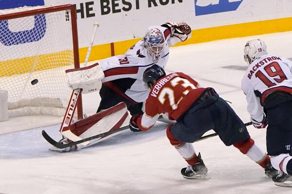 Florida Panthers center Carter Verhaeghe (23) scores a goal against Washington Capitals goaltender Ilya Samsonov (30) during the third period of Game 5 of the first round of the NHL Stanley Cup hockey playoffs, Wednesday, May 11, 2022, in Sunrise, Fla. (AP Photo/Lynne Sladky)