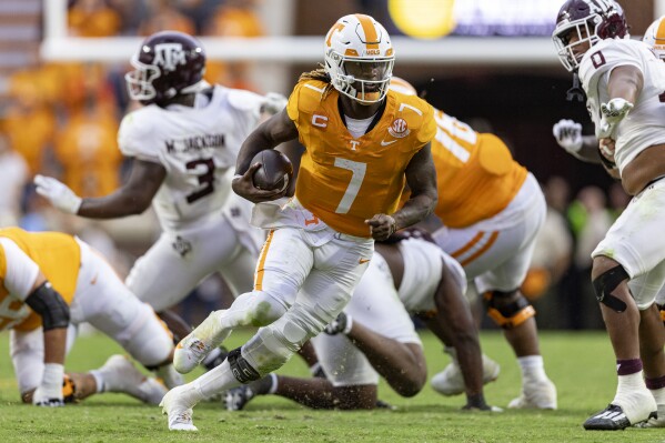 Tennessee quarterback Joe Milton III (7) runs for yardage during the second half of an NCAA college football game against Texas A&M, Saturday, Oct. 14, 2023, in Knoxville, Tenn. (AP Photo/Wade Payne)