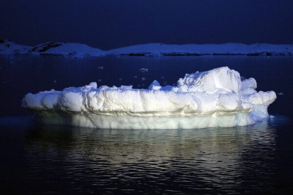 An iceberg floats near the Chilean O'Higgins base in Antarctica, Thursday, Nov. 23, 2023. (AP Photo/Jorge Saenz)