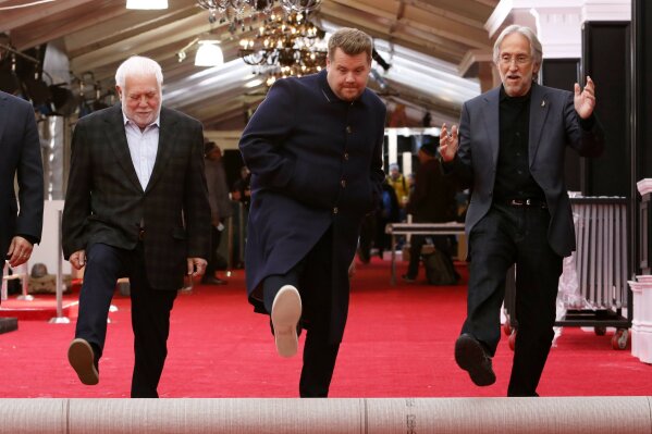 
              Producer Ken Ehrlich, from left, Grammys host James Corden, and president of The Recording Academy Neil Portnow participate in the 60th annual Grammy Awards red carpet roll out at Madison Square Garden on Thursday, Jan. 25, 2018, in New York. The 60th grammy Awards will be held on Sunday. (Photo by Mark Von Holden/Invision/AP)
            