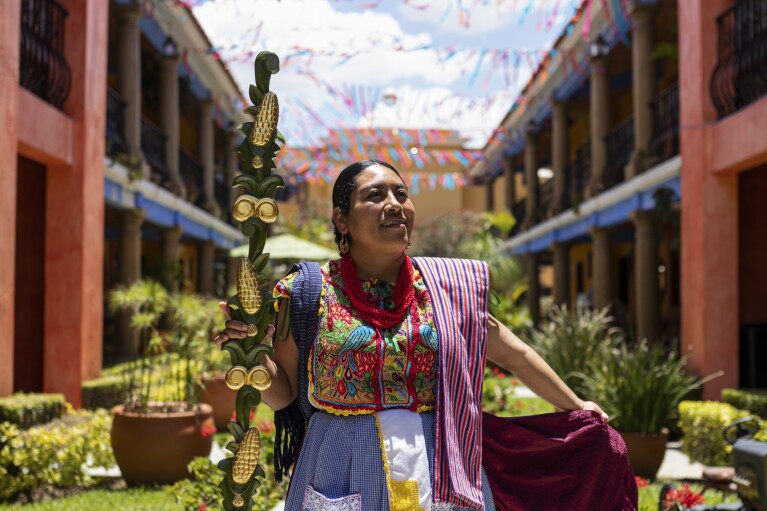 Leticia Santiago poses for a portrait in Oaxaca, Mexico, Sunday, July 16, 2023. The 35-year-old was elected as Centéotl goddess in late June, which means she’ll represent the Aztec deity of maize for a year and lead all festivities during the Guelaguetza festival. (AP Photo/Maria Alferez)