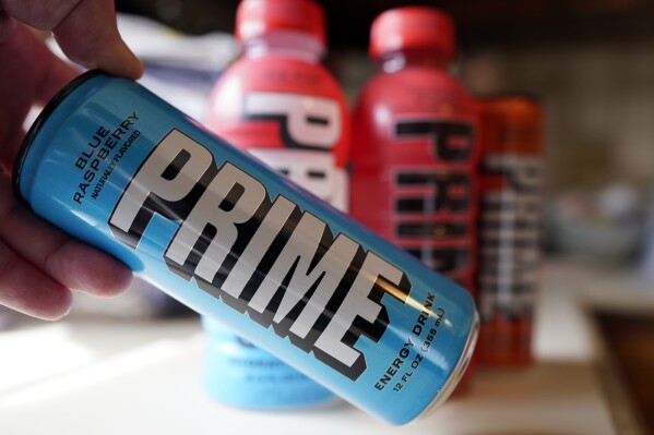 A PRIME Energy drink is seen, Friday, March 24, 2023, in Detroit. The influencer-backed energy drink that has earned viral popularity among children is facing scrutiny from lawmakers and health experts over its potentially dangerous levels of caffeine. (AP Photo/Carlos Osorio)