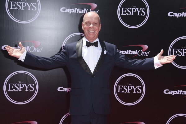 FILE - Scott Hamilton arrives at the ESPY Awards at the Microsoft Theater on Wednesday, July 13, 2016, in Los Angeles. Scott Hamilton can scarcely believe that it has been four decades since he stood atop the Olympic podium in Sarajevo. To commemorate the anniversary of that night at Zetra Olympic Hall, the American figure skating icon is planning to reunite with the rest of the podium — Canadian silver medalist Brian Orser and bronze medalist Josef Sabovcik of Czechoslovakia — for a series of events to raise funds for his foundation and the Memorial Sloan Kettering Cancer Center. (Photo by Jordan Strauss/Invision/AP, File)