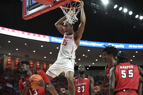 Houston forward Fabian White Jr. (35) dunks the ball against Louisiana Lafayette during the first half of an NCAA college basketball game Tuesday, Dec. 14, 2021, in Houston. (AP Photo/Justin Rex)